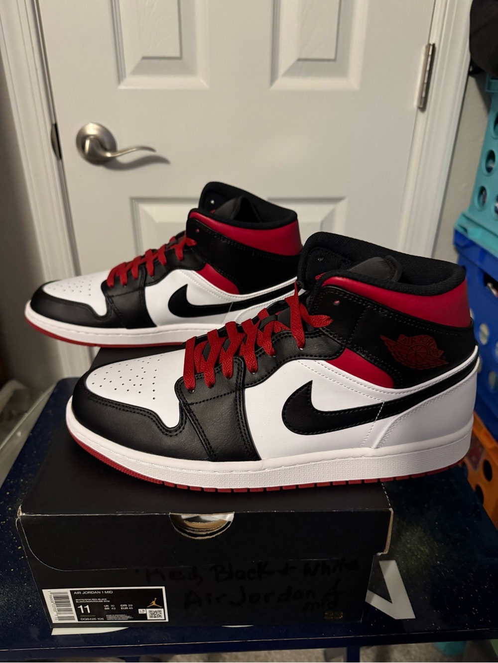 Air Jordan 1 Mid Sneakers in Black, White, Red